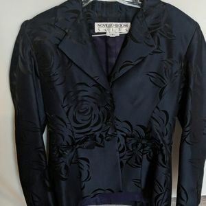 BARELY WORN LOOKS AND FEELS LIKE SILK SUIT.